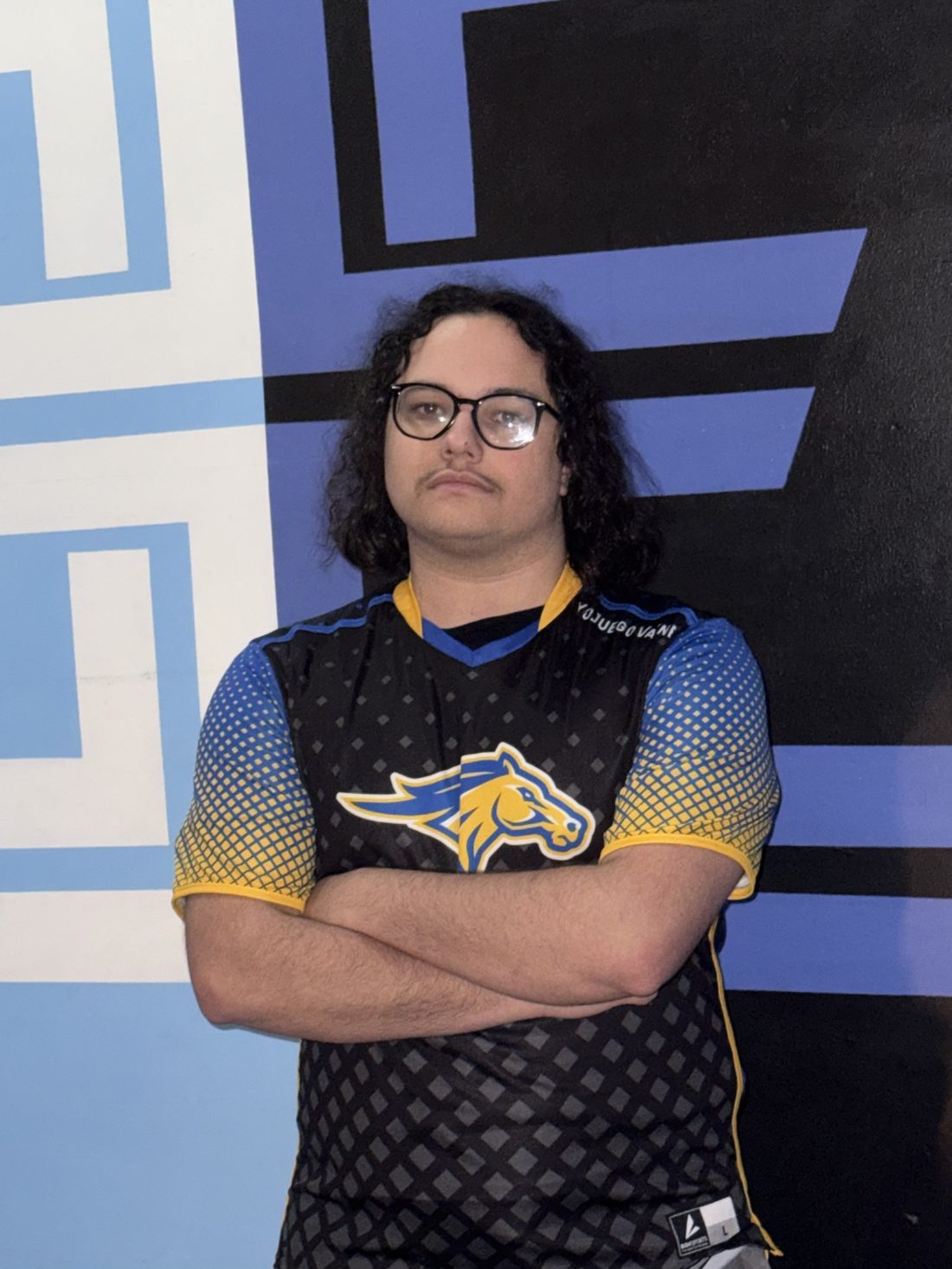 Monroe Mustangs esports player in the official team jersey
